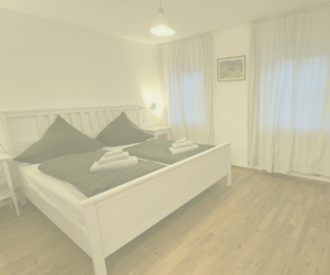 Zimmer mit Bett